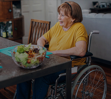 Person in wheelchair eating a salad