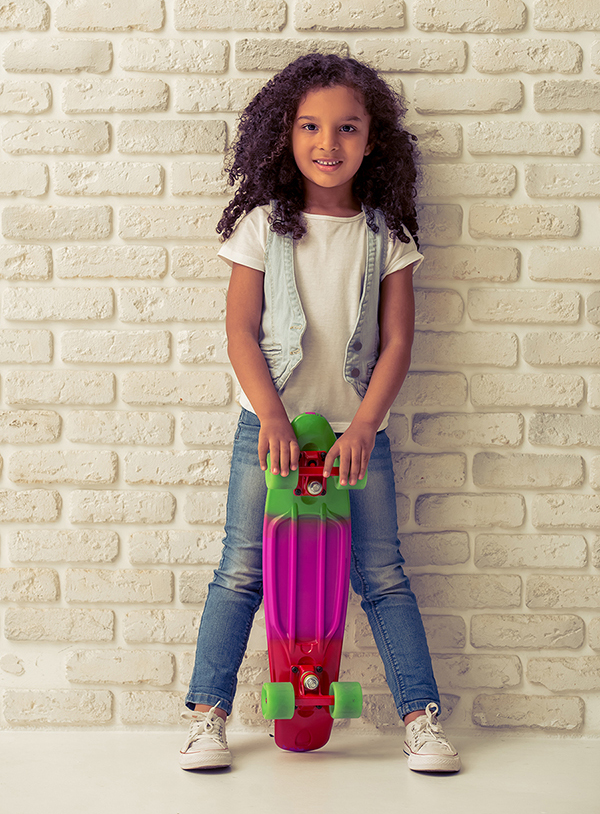 young girl holding a skateboard