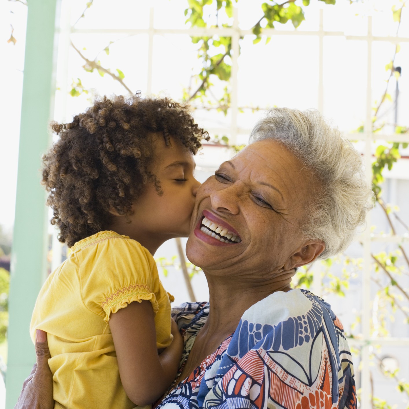 A loving grandmother holds her adopted grandson.