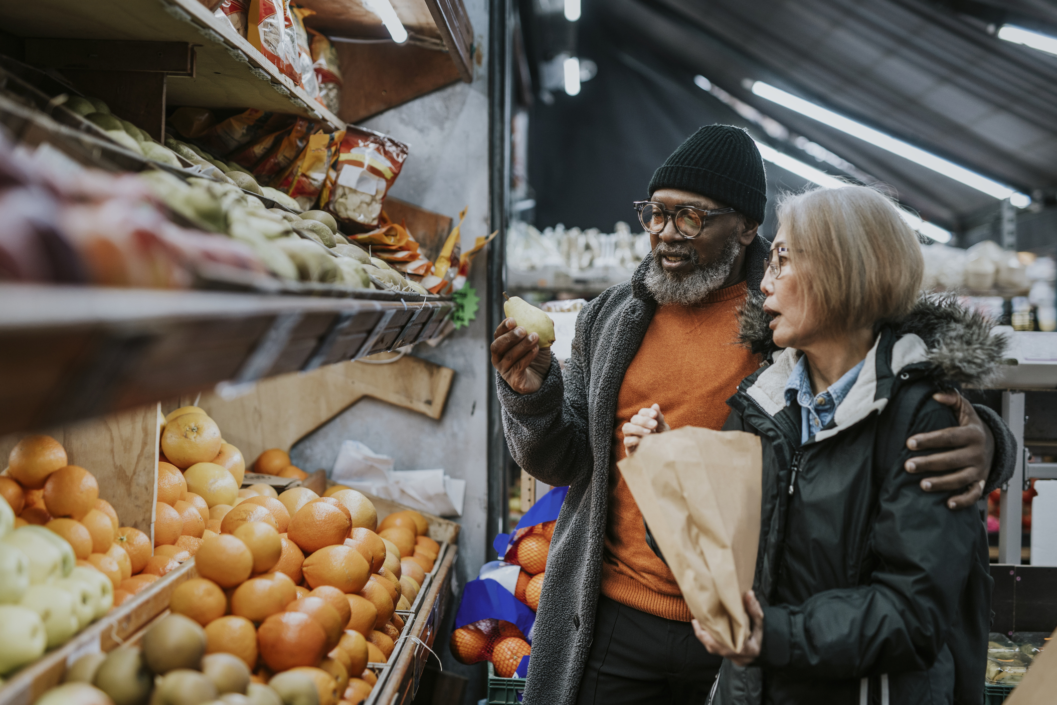 An African American couple purchasing groceries.
