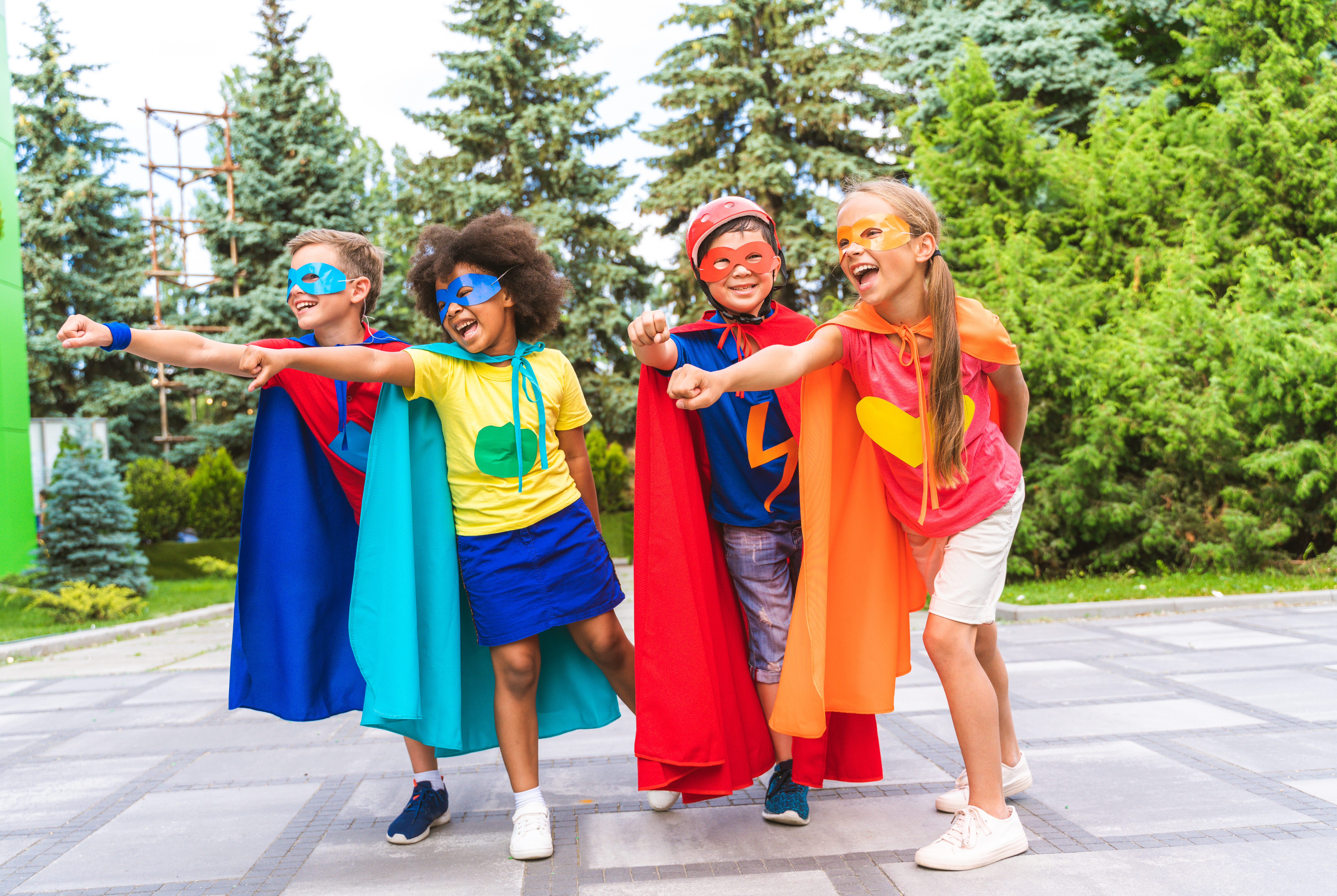 A group of children dressed as superheroes.
